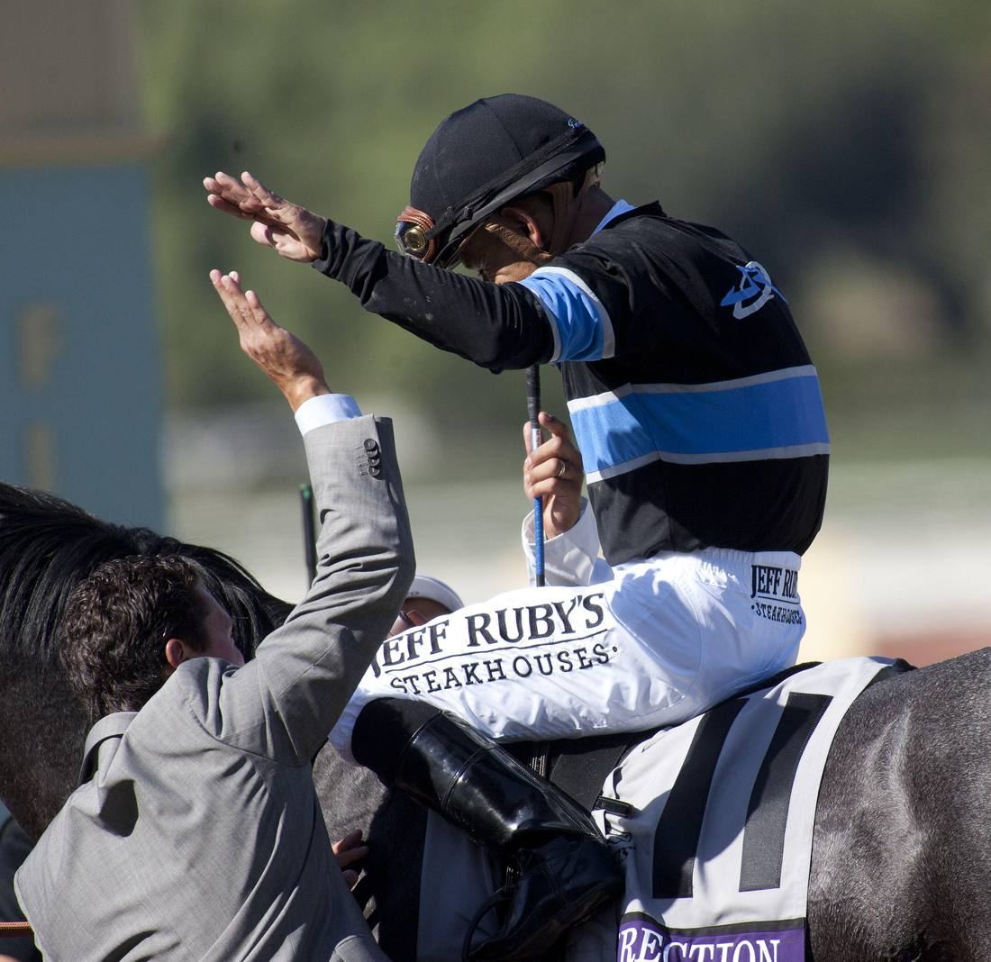 Alex Solis II and Mike Smith after Mizdirection's Breeders' Cup win