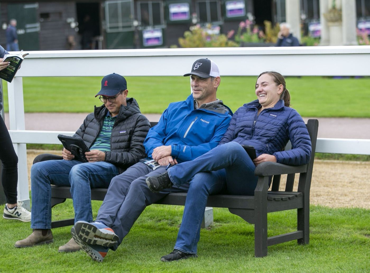 Alex Solis II, Jason Litt and Madison Scott on a bench at Tattersalls